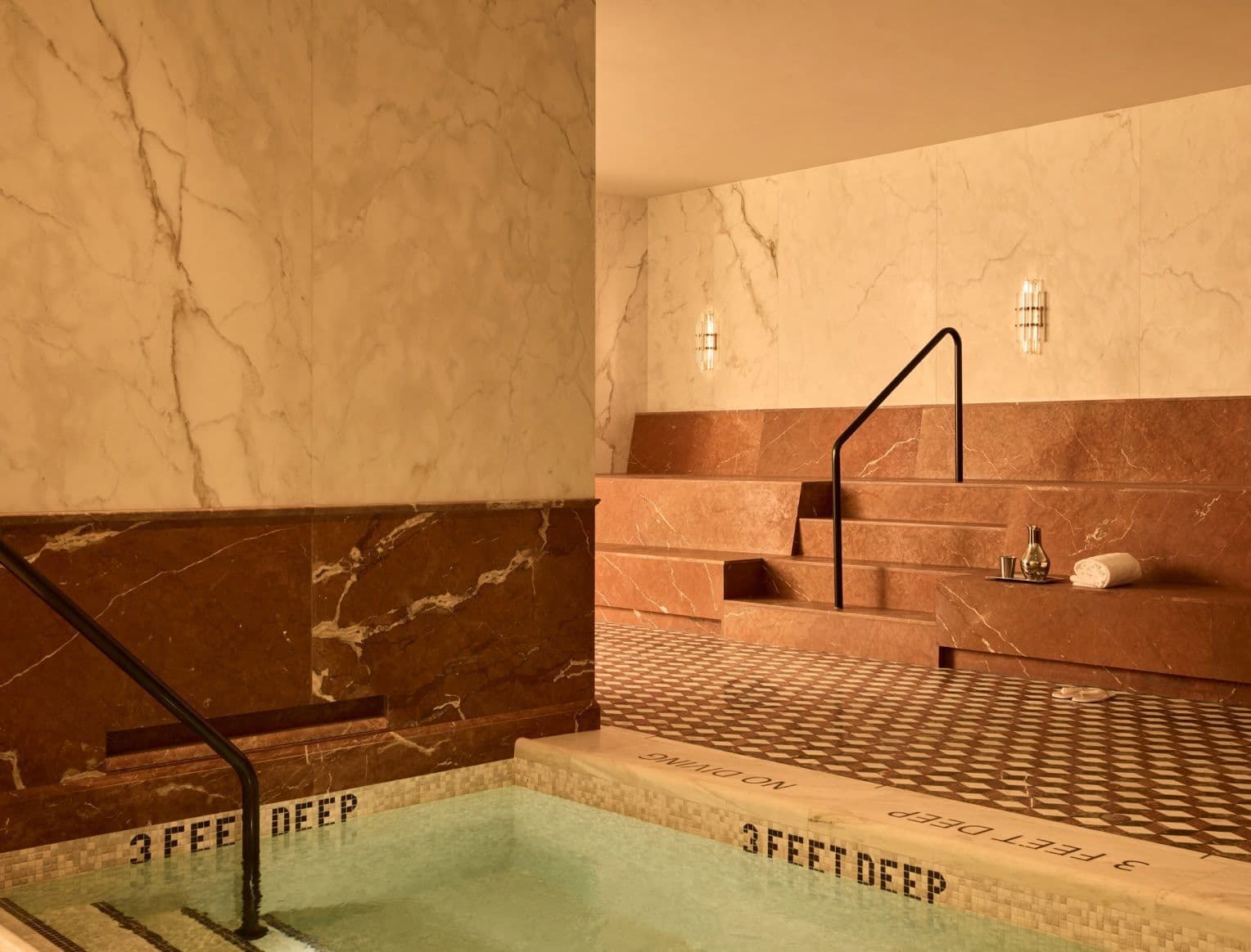 A photo inside the bathhouse at Bedrock with a view of the hammam-style benches in members' club Moss New York.
